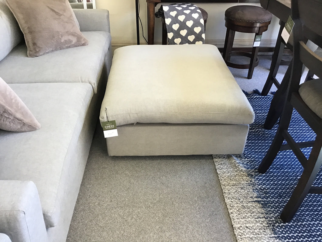 Just Modern Ottoman in Benavento Dove III by Justice Furniture JMIOT