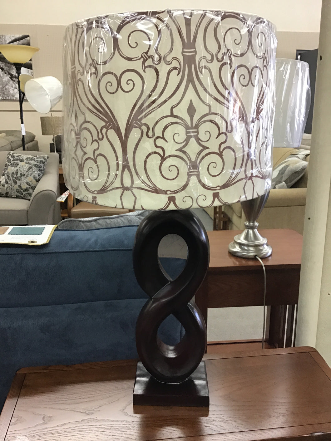 McQuerter Brown Figure Eight Table Lamp by Home Accents 631
